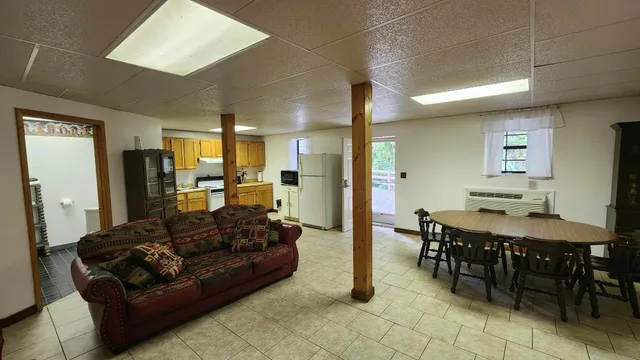 a kitchen with a refrigerator a stove top oven a sink and dishwasher