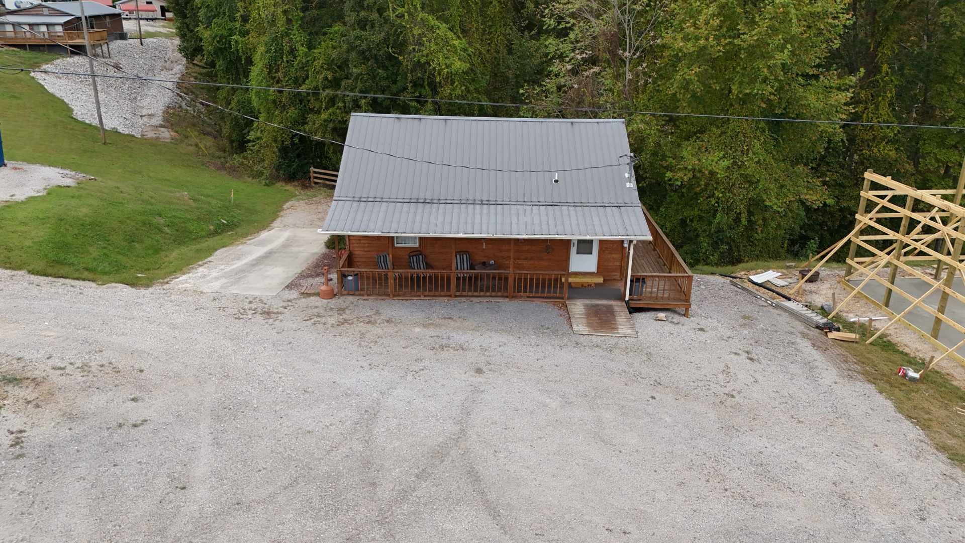 228 Bill Hunter Road Celina, TN 38551 - Photo 36 of 57 a white house with a yard