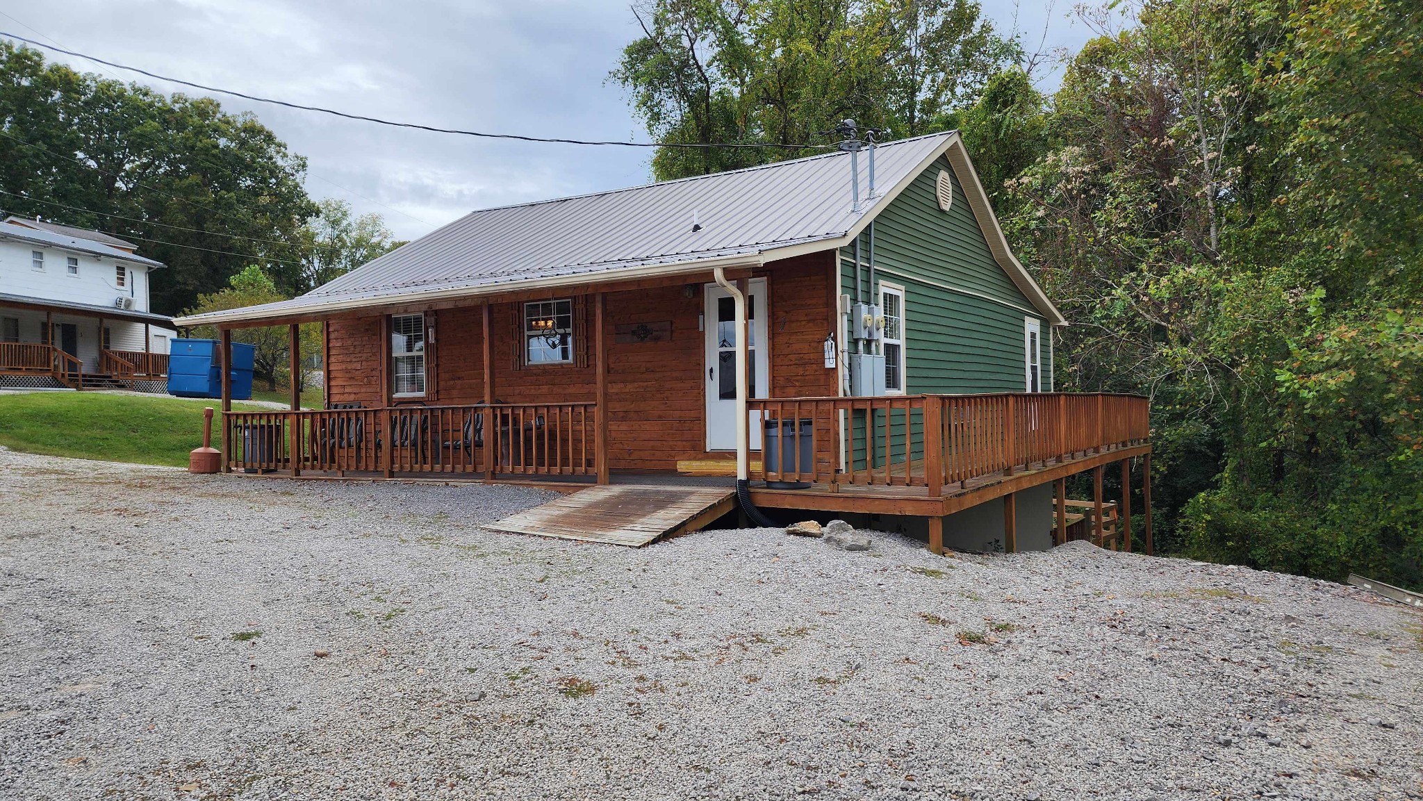 228 Bill Hunter Road Celina, TN 38551 - Photo 40 of 57 a view of a house with backyard and trees