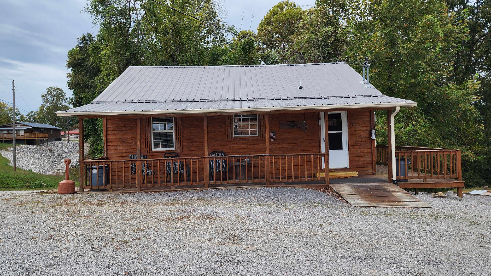 228 Bill Hunter Road Celina, TN 38551 - Photo 42 of 57 a front view of a house with a garden