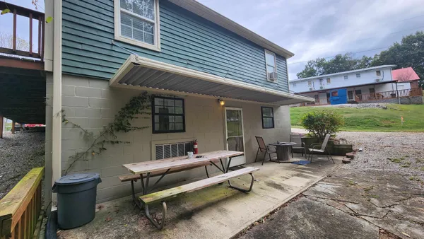 an aerial view of residential houses with outdoor space