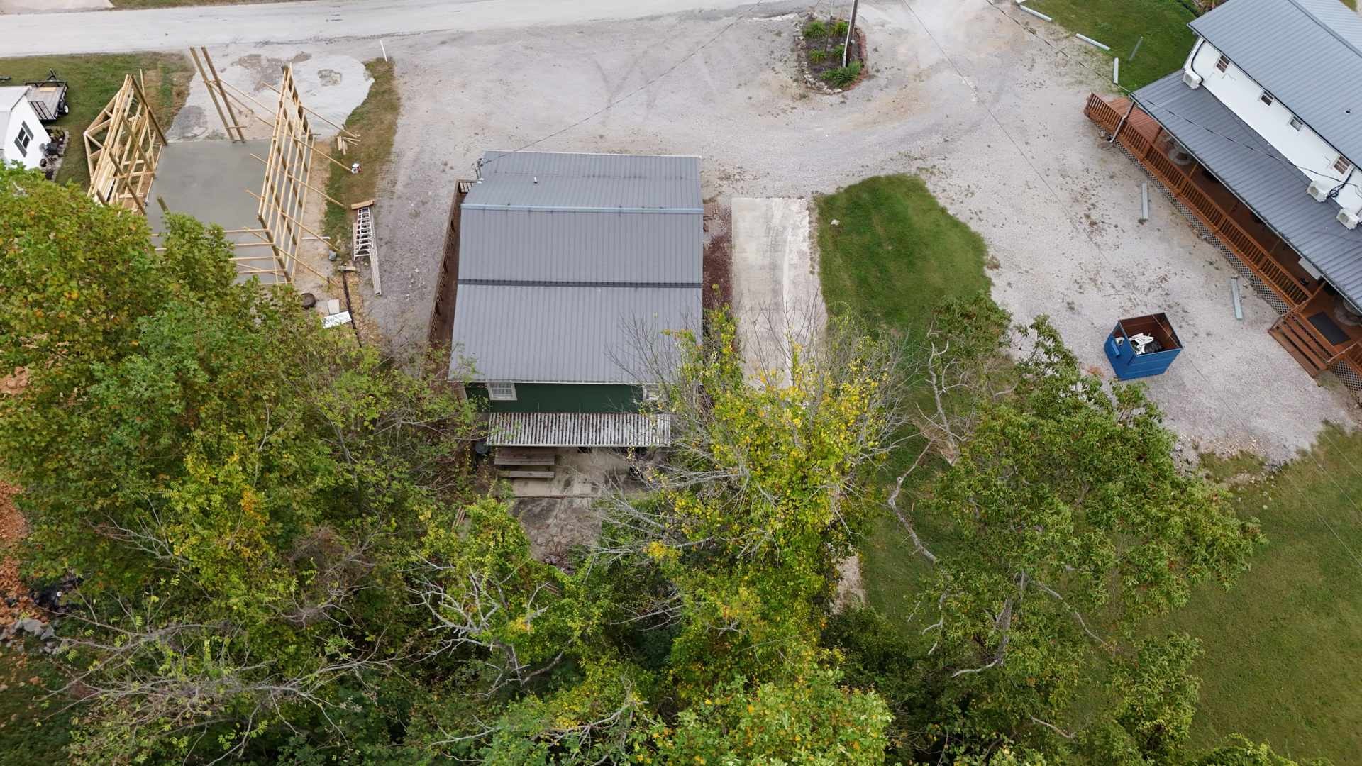 228 Bill Hunter Road Celina, TN 38551 - Photo 48 of 57 an aerial view of a house with a yard and trees