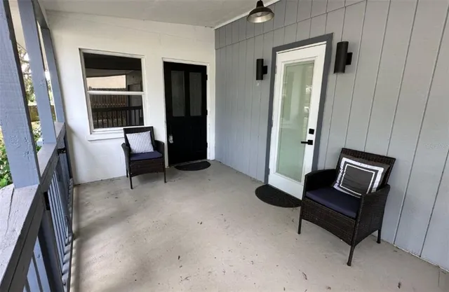 a living room with furniture and a window