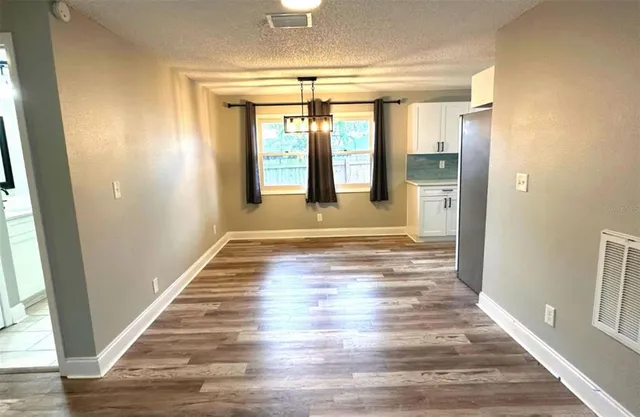 a view of entryway with wooden floor