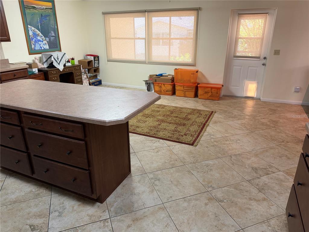 9529 Southwest 85th Avenue, Unit D Ocala, FL 34481 - Photo 7 of 21 a kitchen with a stove a sink and a refrigerator