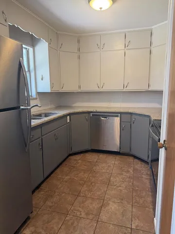 a kitchen with a sink and cabinets