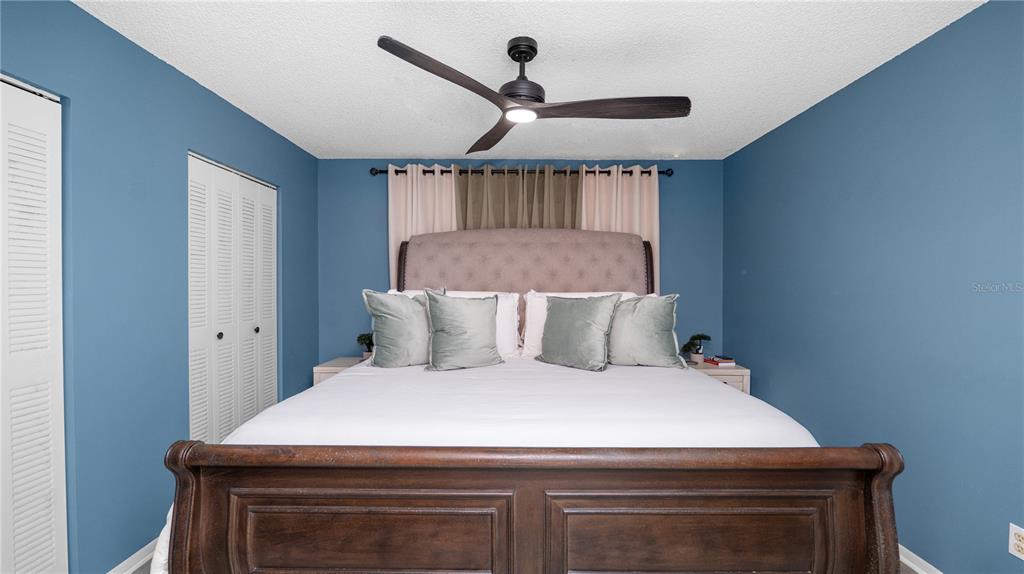 628 Ridge Terrace Winter Haven, FL 33881 - Photo 16 of 44 a bed sitting in a bedroom next to a window