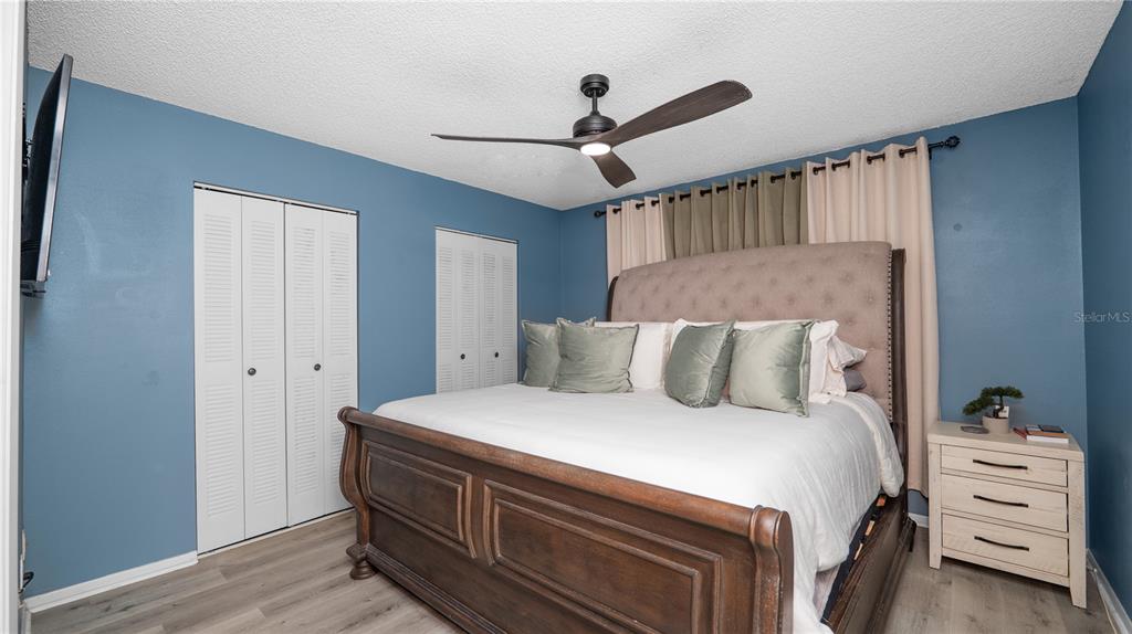 628 Ridge Terrace Winter Haven, FL 33881 - Photo 17 of 44 a bedroom with a bed and a ceiling fan