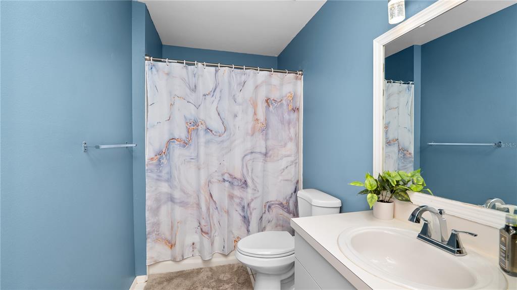 628 Ridge Terrace Winter Haven, FL 33881 - Photo 22 of 44 a bathroom with a sink and toilet