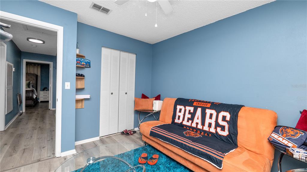 628 Ridge Terrace Winter Haven, FL 33881 - Photo 23 of 44 a bedroom with furniture and wooden floor