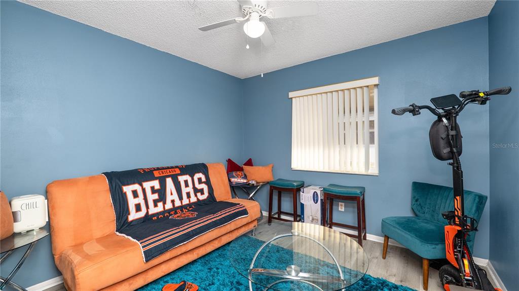 628 Ridge Terrace Winter Haven, FL 33881 - Photo 24 of 44 a living room with furniture a rug and a window
