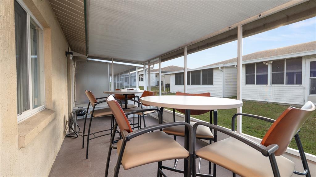 628 Ridge Terrace Winter Haven, FL 33881 - Photo 25 of 44 a view of a patio with table and chairs
