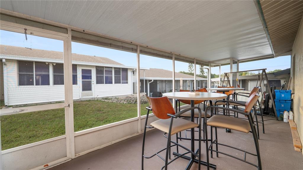 628 Ridge Terrace Winter Haven, FL 33881 - Photo 27 of 44 a view of a patio with table and chairs