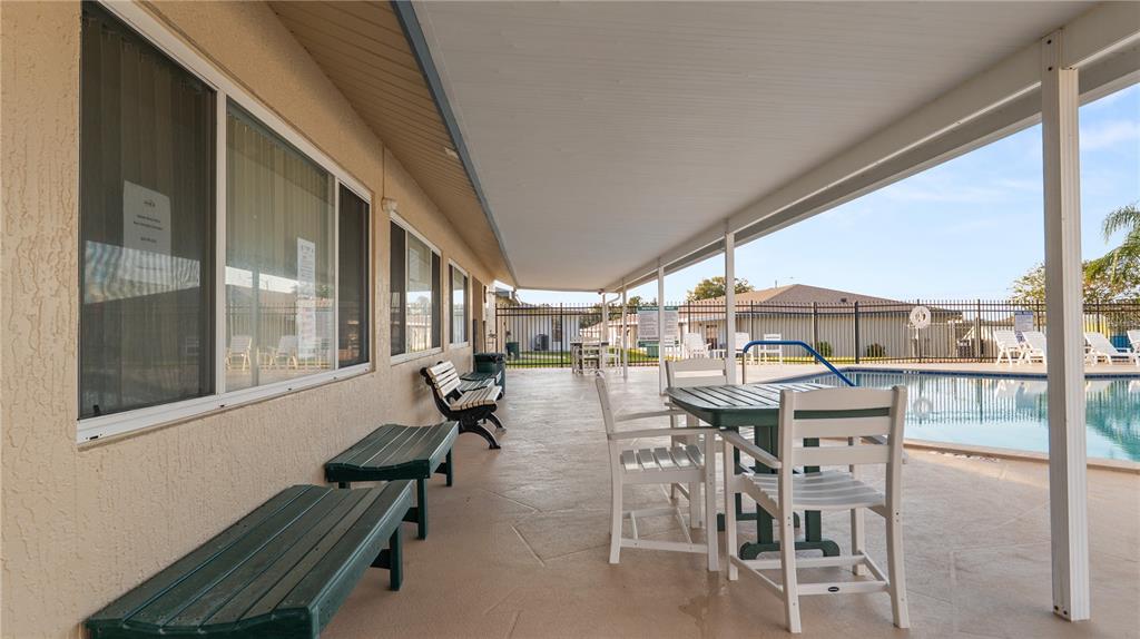 628 Ridge Terrace Winter Haven, FL 33881 - Photo 30 of 44 a patio with table and chairs