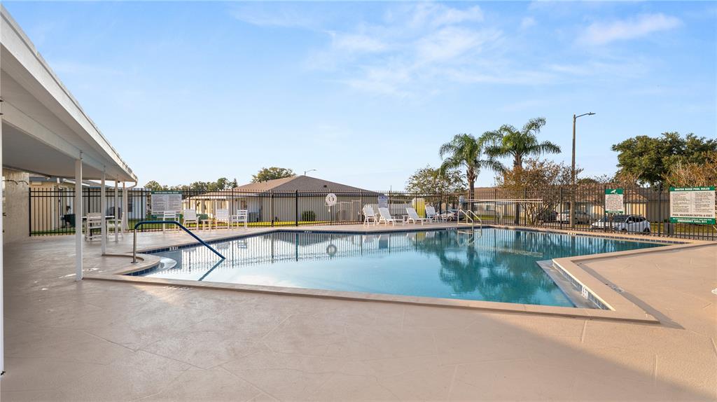 628 Ridge Terrace Winter Haven, FL 33881 - Photo 31 of 44 a view of a swimming pool with an outdoor seating