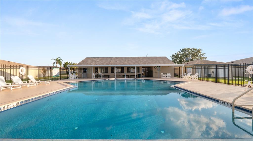 628 Ridge Terrace Winter Haven, FL 33881 - Photo 33 of 44 a view of a house with swimming pool