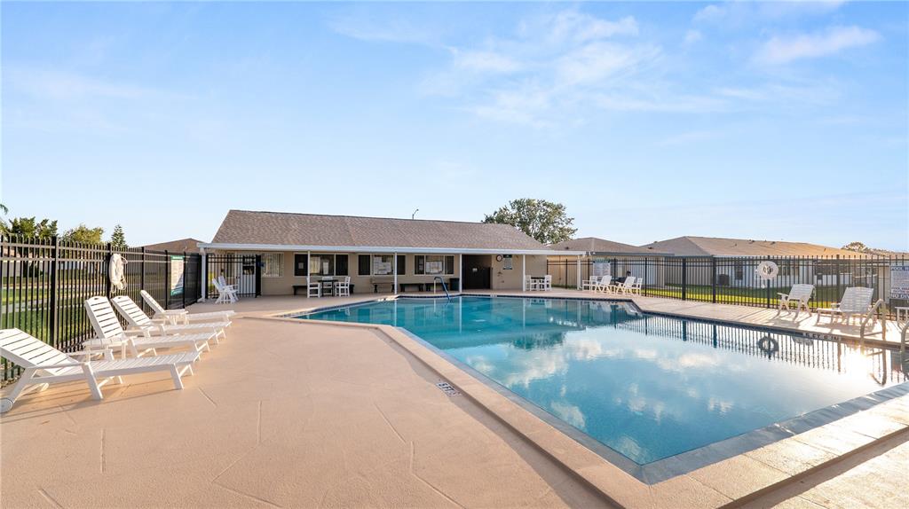 628 Ridge Terrace Winter Haven, FL 33881 - Photo 34 of 44 a view of a house with pool and chairs