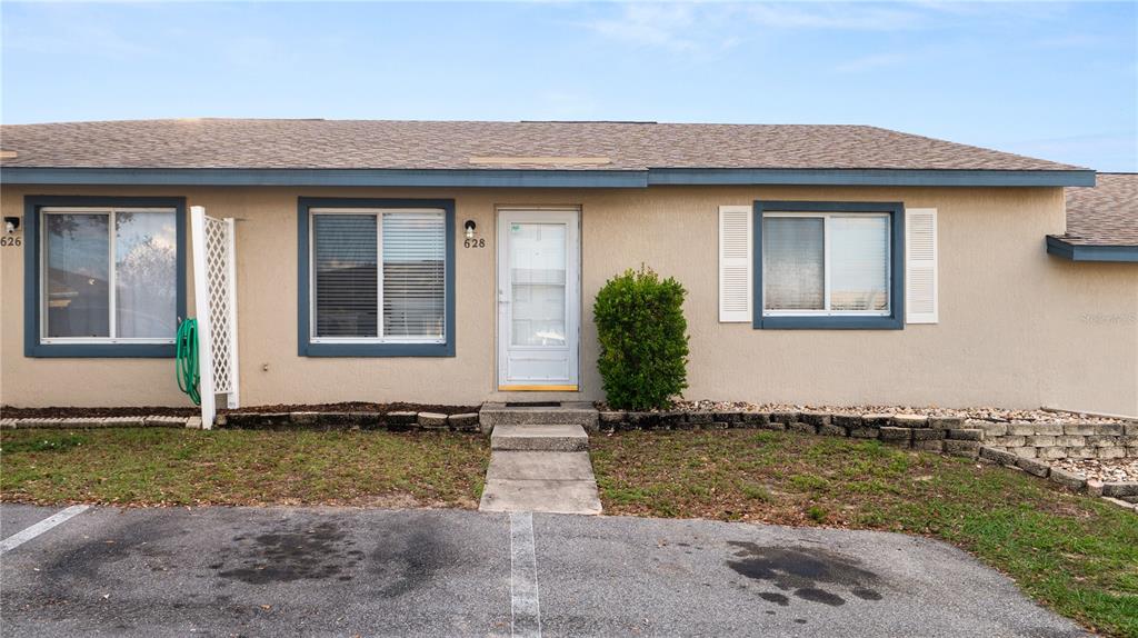 628 Ridge Terrace Winter Haven, FL 33881 - Photo 37 of 44 a front view of a house with a yard