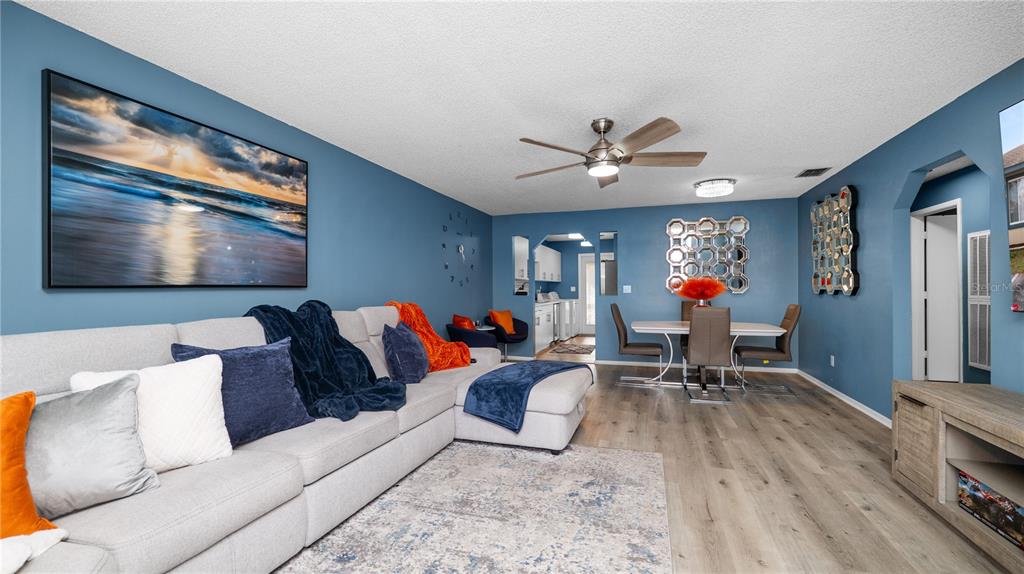 628 Ridge Terrace Winter Haven, FL 33881 - Photo 4 of 44 a living room with furniture and a flat screen tv