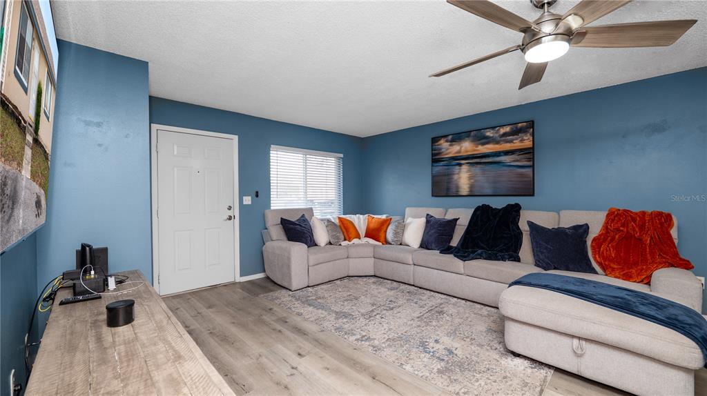 628 Ridge Terrace Winter Haven, FL 33881 - Photo 5 of 44 a living room with furniture and a flat screen tv
