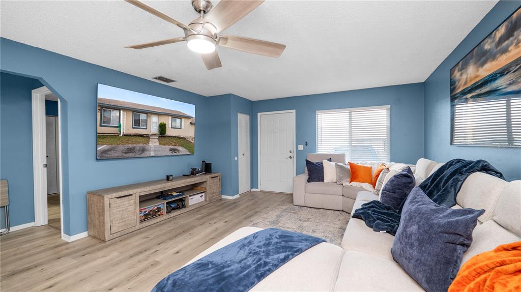 628 Ridge Terrace Winter Haven, FL 33881 - Photo 7 of 44 a living room with furniture and a flat screen tv