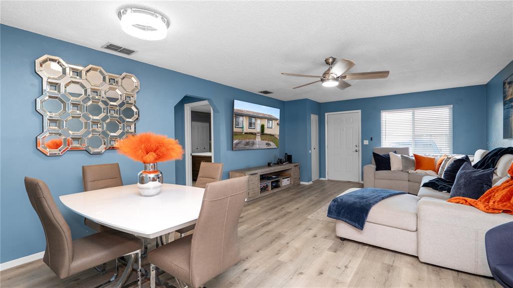 628 Ridge Terrace Winter Haven, FL 33881 - Photo 8 of 44 a living room with furniture and wooden floor