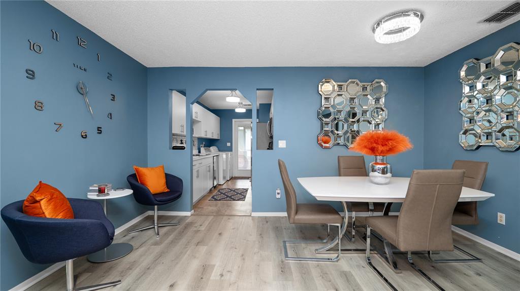 628 Ridge Terrace Winter Haven, FL 33881 - Photo 9 of 44 a dining room with furniture and wooden floor