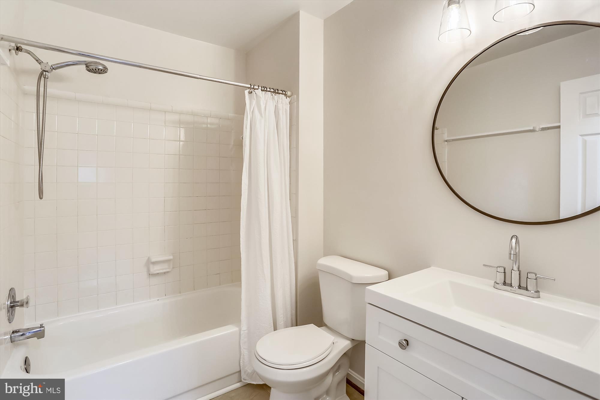 2014 Flowering Tree Terrace Silver Spring, MD 20902 - Photo 19 of 33 New Vanity, Mirror, Light & Toilet