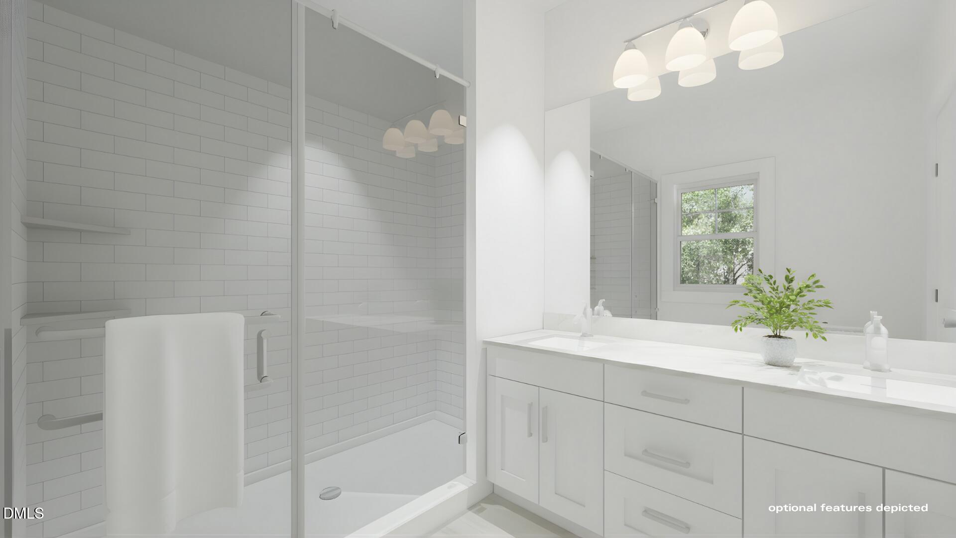 101 Stillwater Lane Roxboro, NC 27574 - Photo 7 of 14 a bathroom with a sink a mirror and a shower