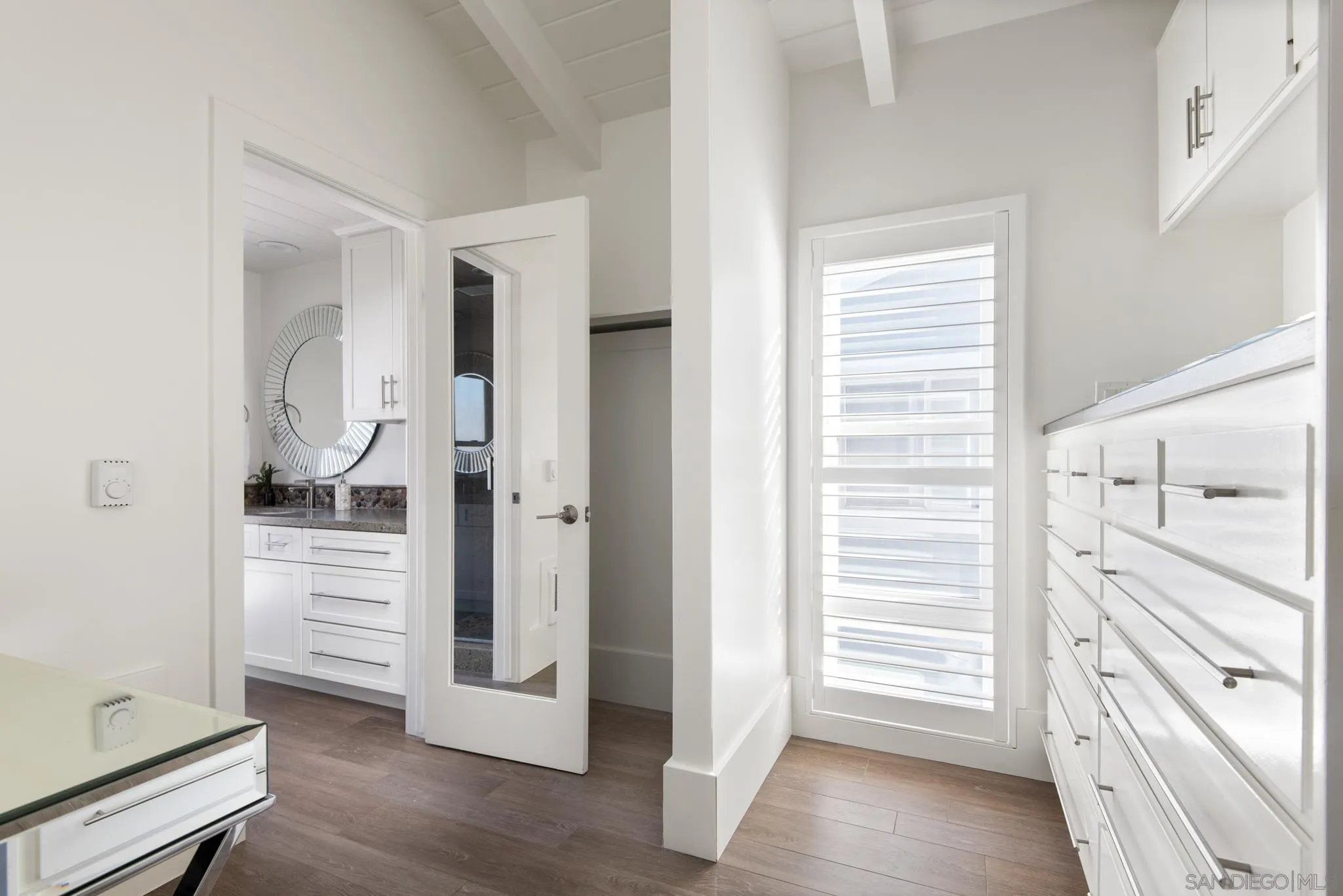 1933 Coast Boulevard Del Mar, CA 92014 - Photo 11 of 47 a view of a walk in closet and hardwood floor