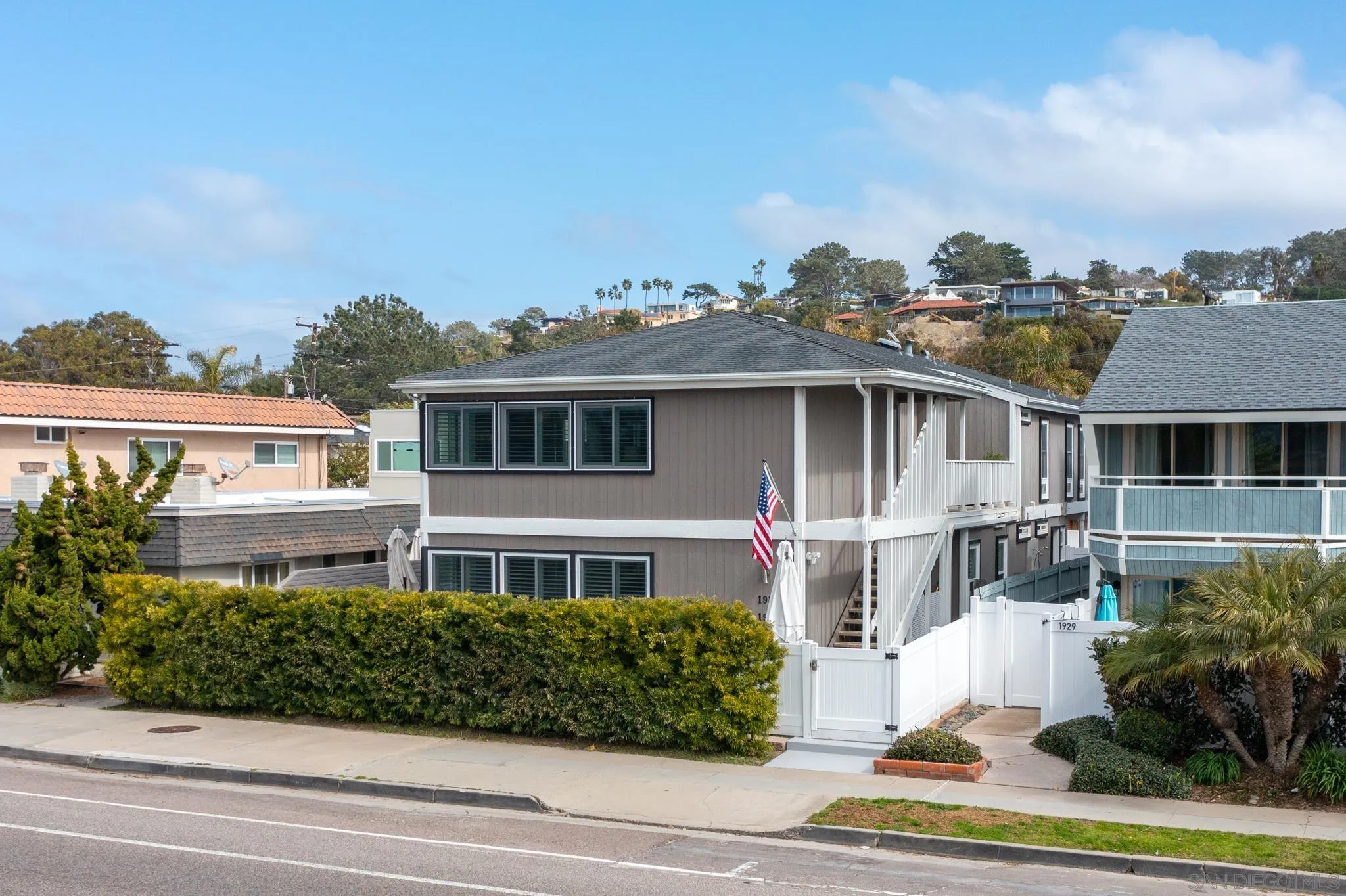 1933 Coast Boulevard Del Mar, CA 92014 - Photo 12 of 47 a front view of a house with a garden