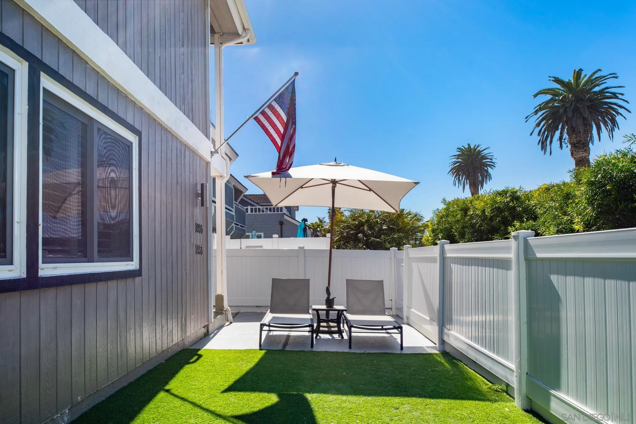 1933 Coast Boulevard Del Mar, CA 92014 - Photo 19 of 47 a view of a chairs and table in backyard of the house
