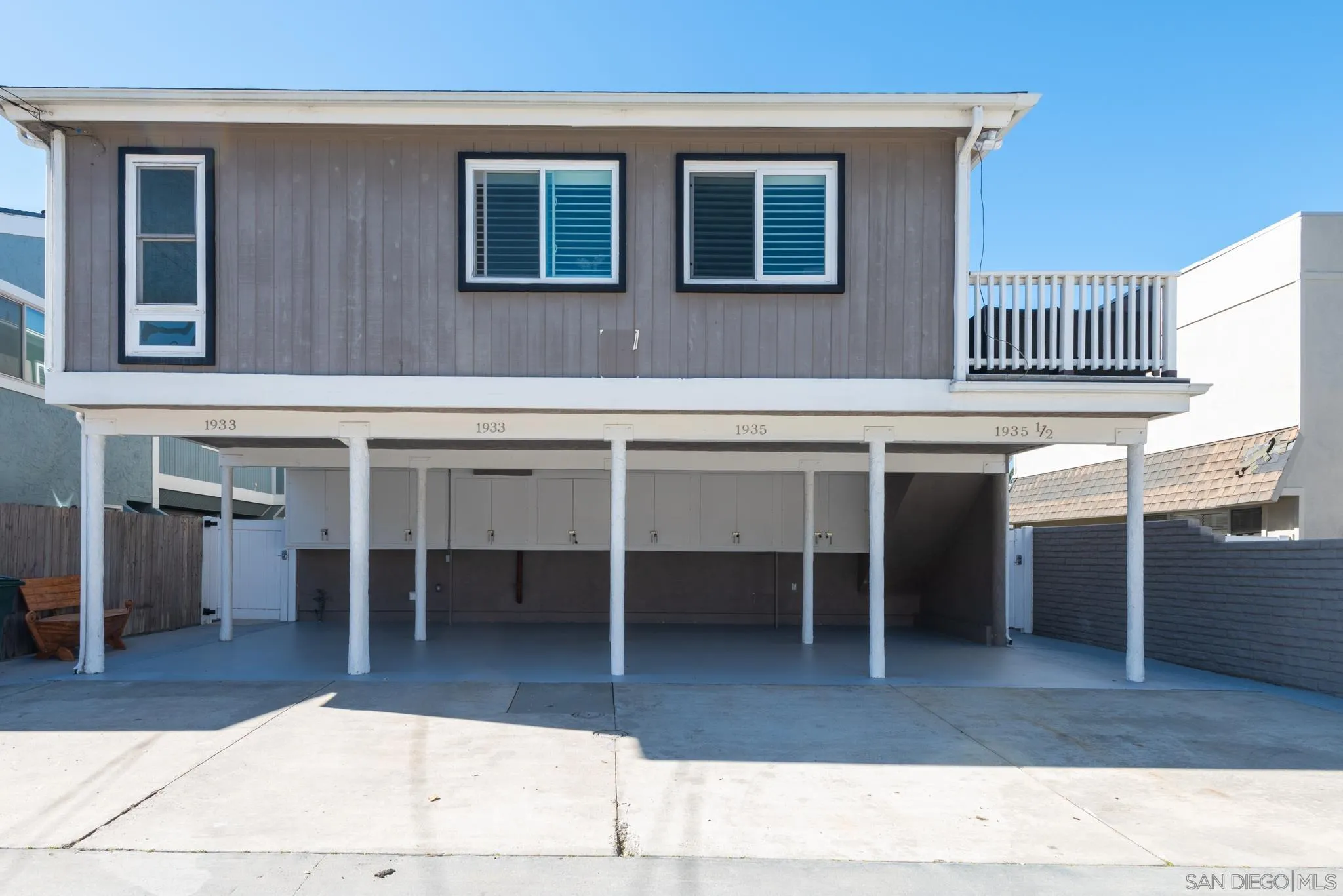 1933 Coast Boulevard Del Mar, CA 92014 - Photo 20 of 47 a living room with a couch and a chandelier