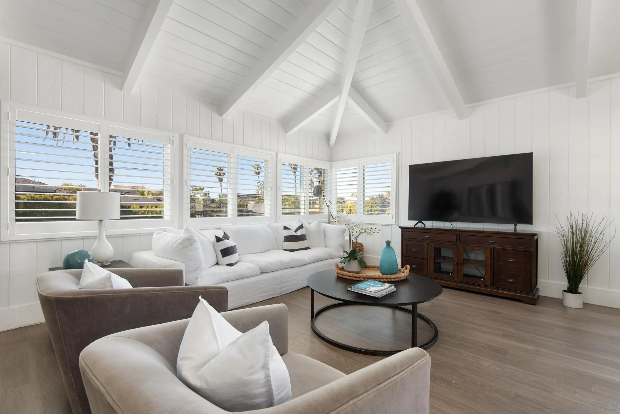 1933 Coast Boulevard Del Mar, CA 92014 - Photo 2 of 47 a living room with furniture and a flat screen tv