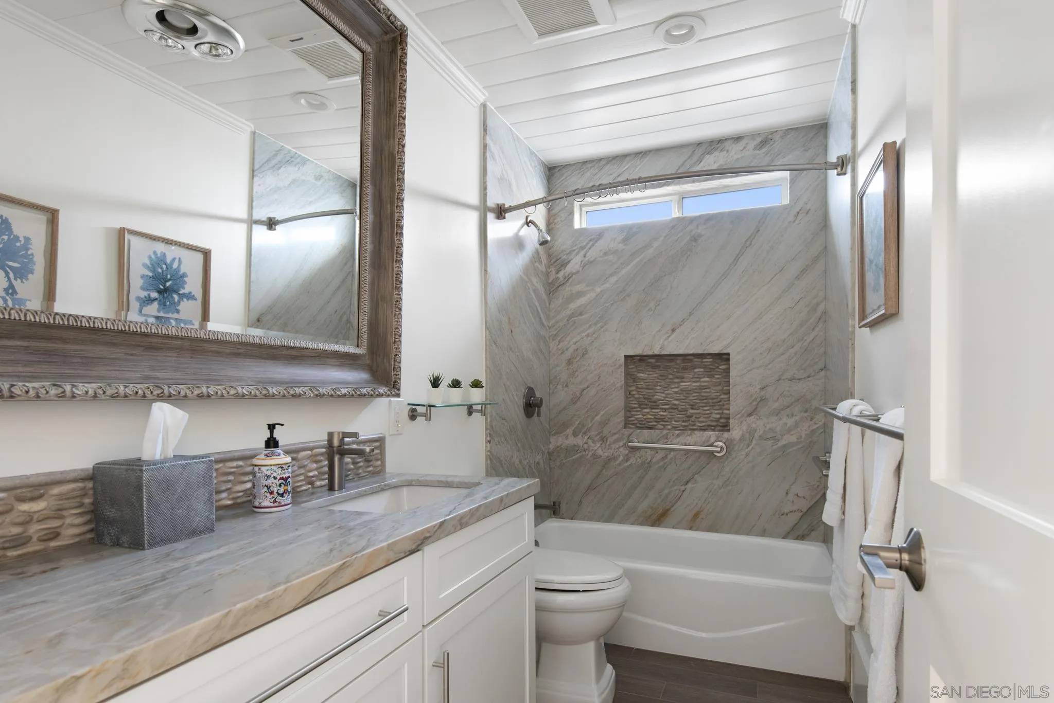 1933 Coast Boulevard Del Mar, CA 92014 - Photo 30 of 47 a bathroom with a granite countertop sink toilet and shower
