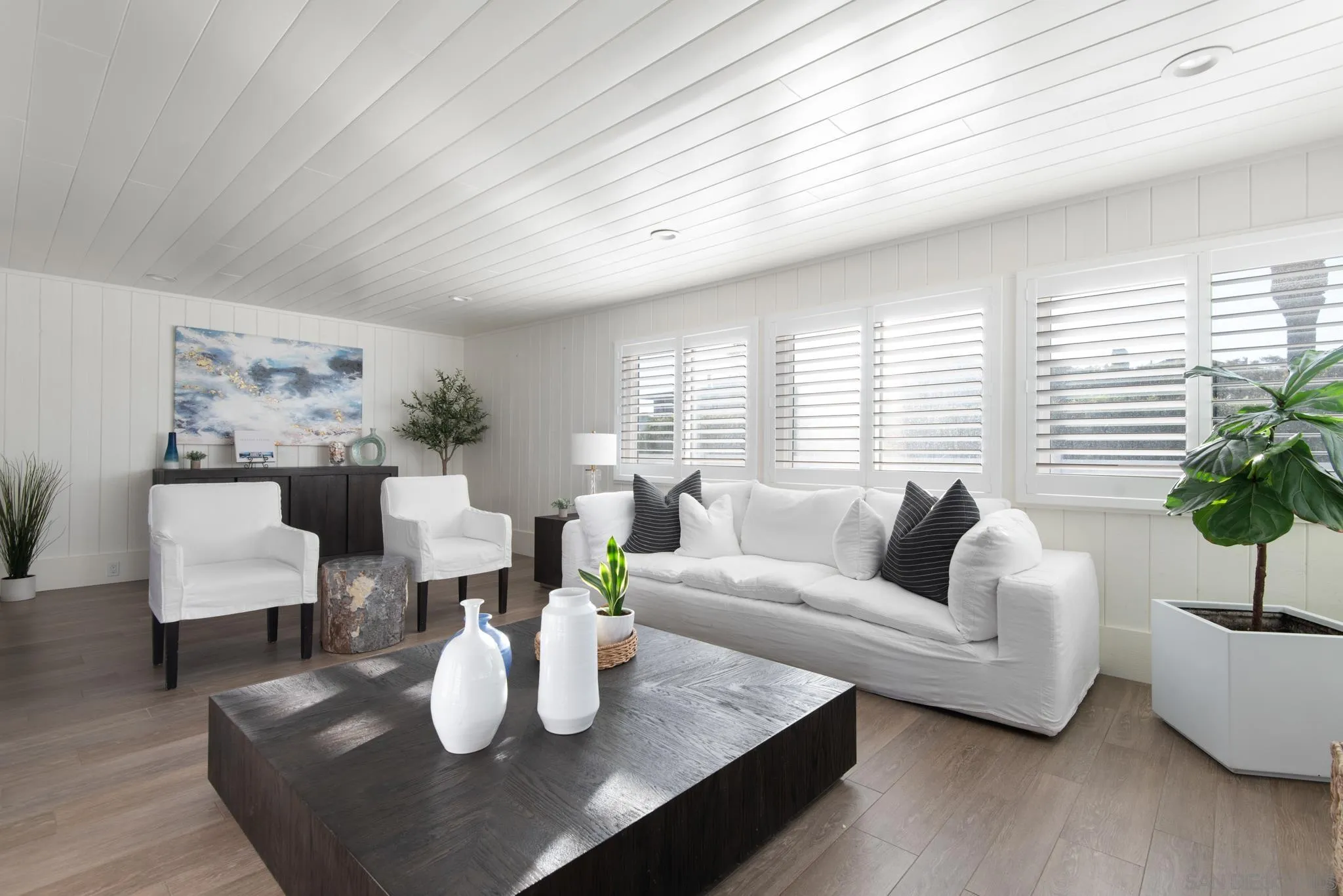 1933 Coast Boulevard Del Mar, CA 92014 - Photo 3 of 47 a living room with furniture and a potted plant