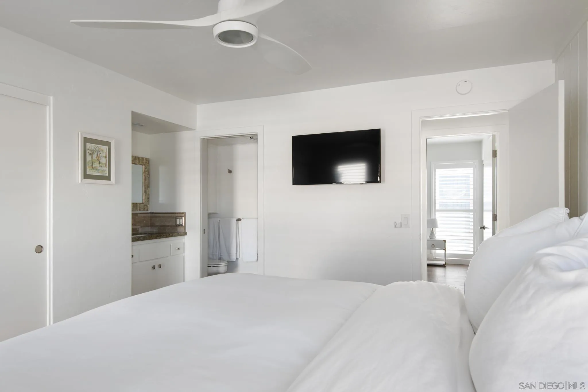 1933 Coast Boulevard Del Mar, CA 92014 - Photo 31 of 47 a bedroom with a bed and a flat screen tv