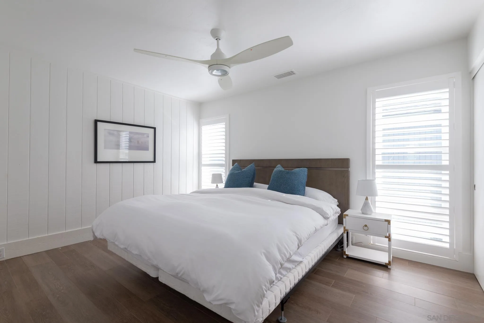 1933 Coast Boulevard Del Mar, CA 92014 - Photo 36 of 47 a bedroom with a bed and a window