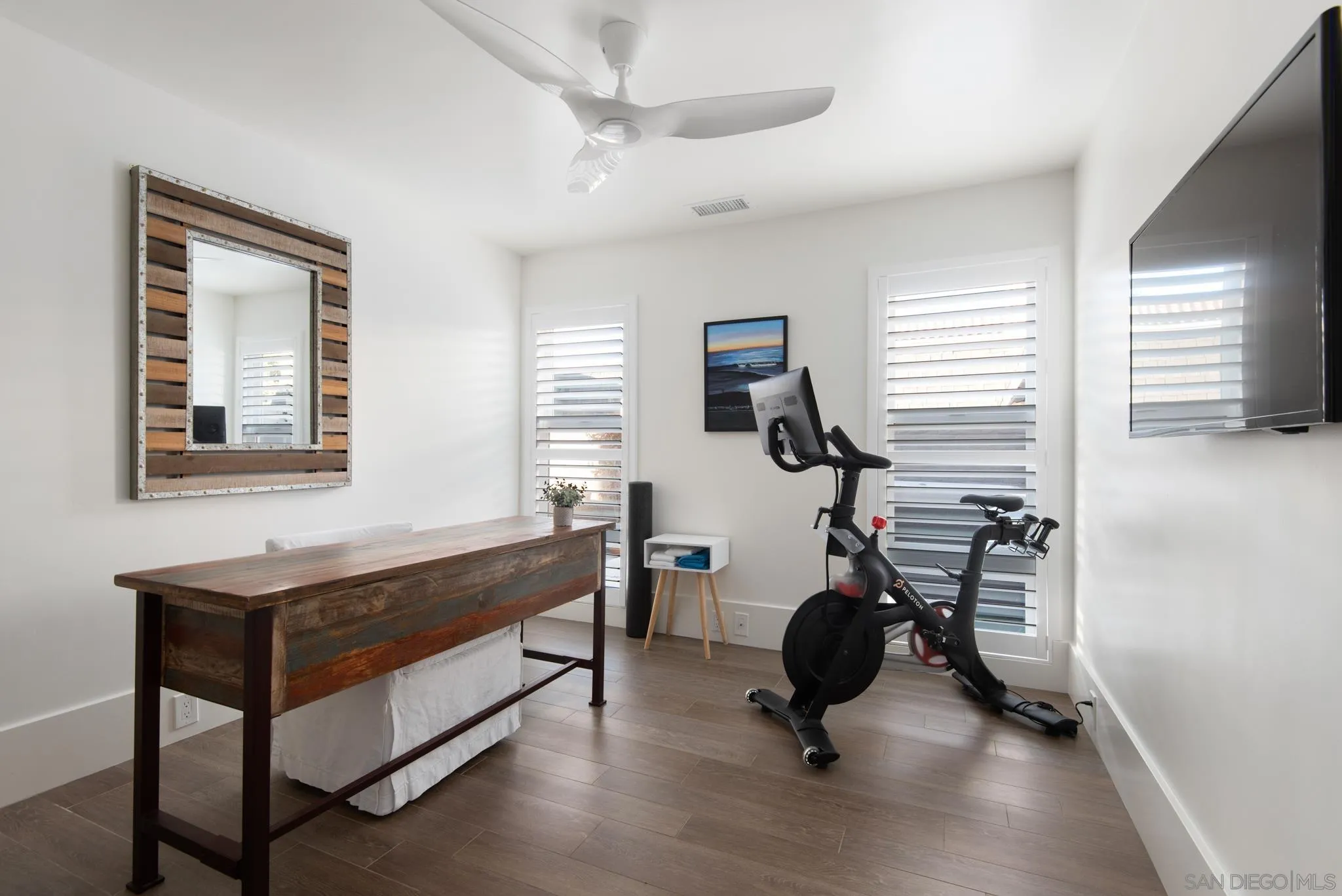 1933 Coast Boulevard Del Mar, CA 92014 - Photo 38 of 47 a living room with furniture gym equipment and a window