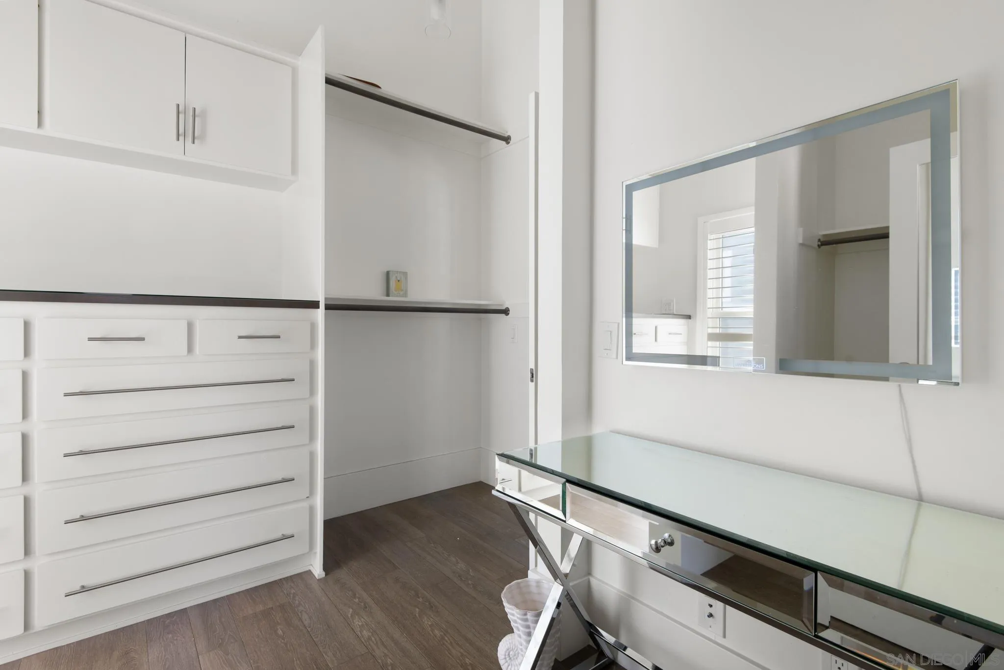 1933 Coast Boulevard Del Mar, CA 92014 - Photo 41 of 47 a view of walk in closet with empty racks