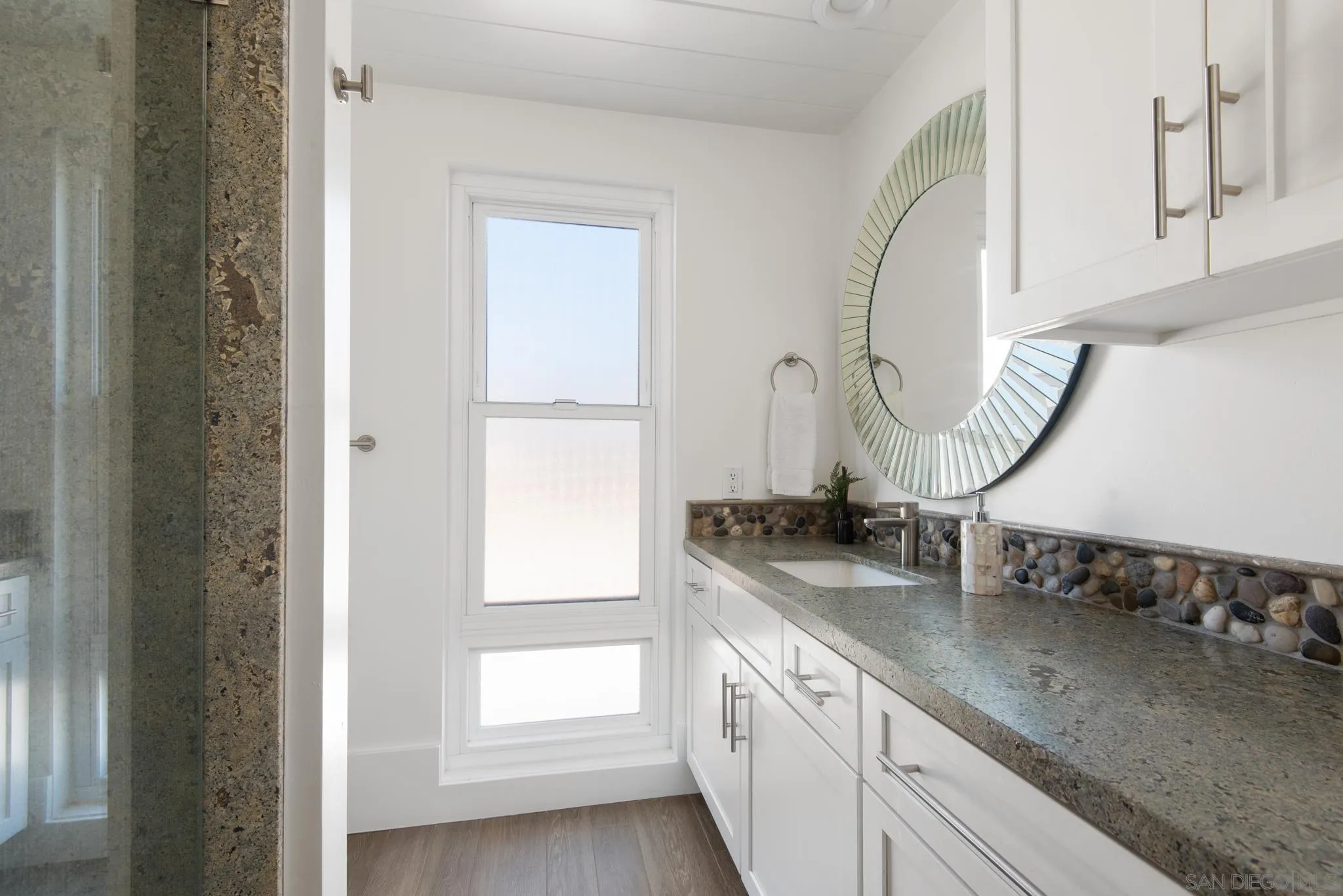 1933 Coast Boulevard Del Mar, CA 92014 - Photo 42 of 47 a bathroom with sinks and a mirror