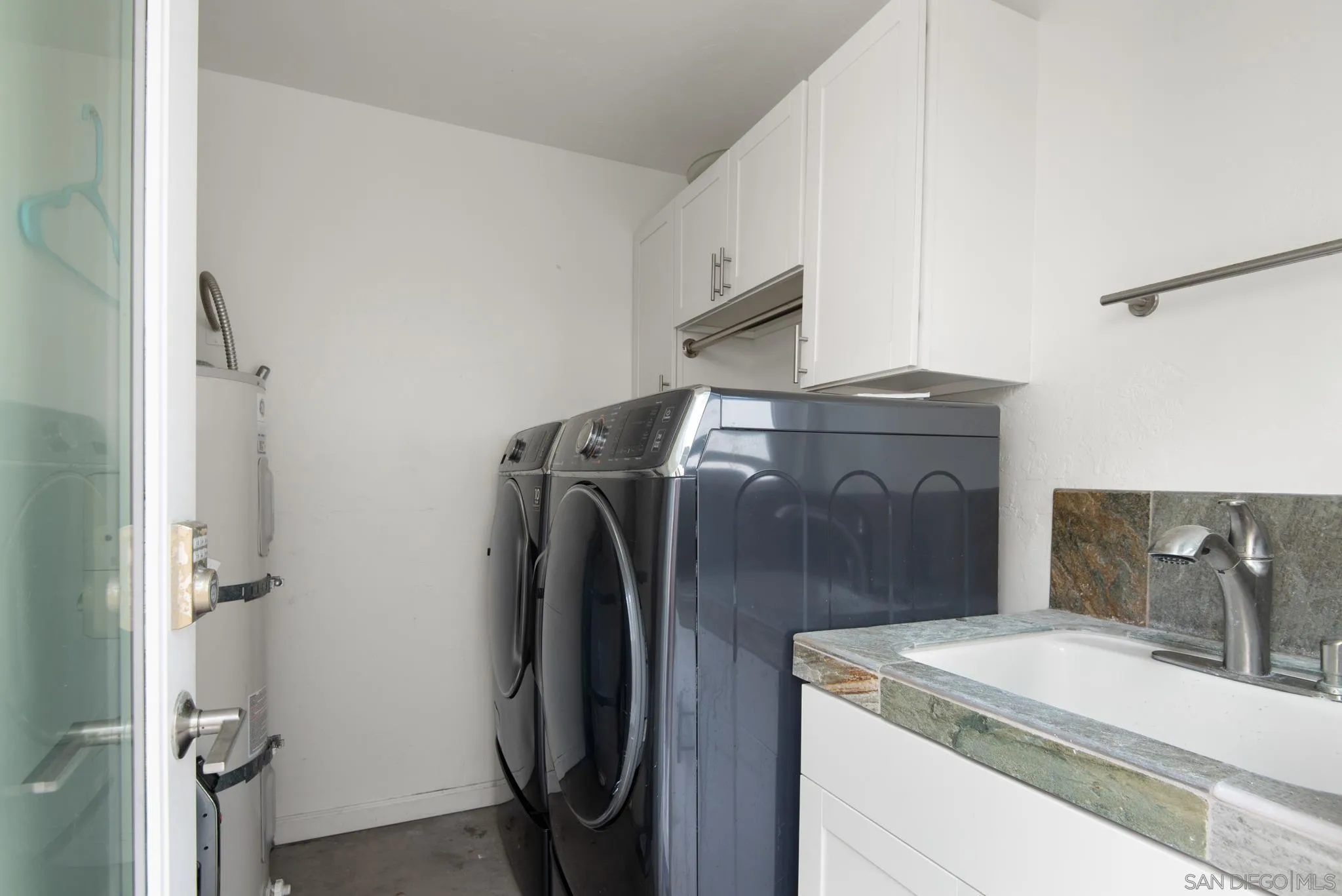 1933 Coast Boulevard Del Mar, CA 92014 - Photo 47 of 47 a utility room with dryer and washer