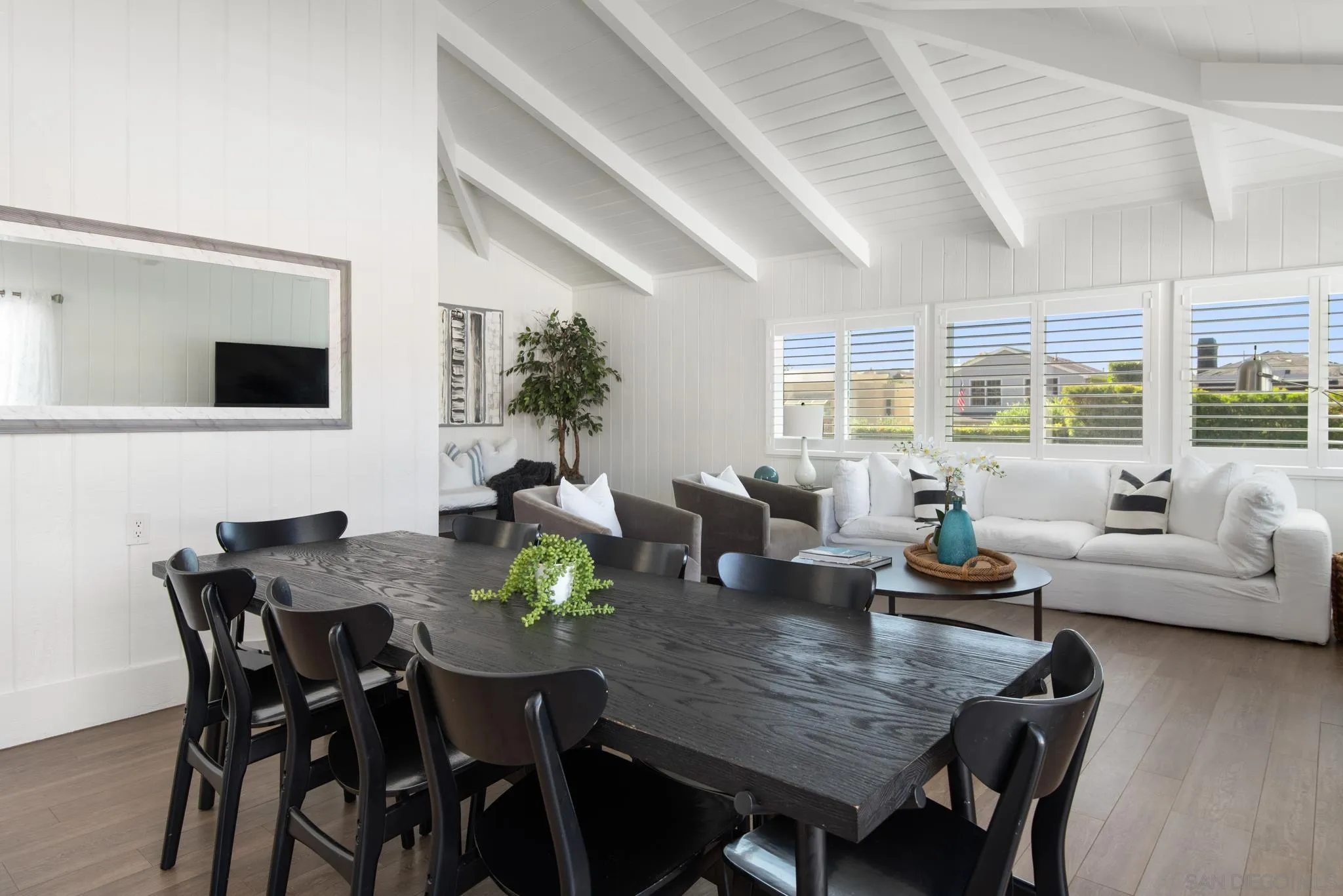 1933 Coast Boulevard Del Mar, CA 92014 - Photo 6 of 47 a view of a dining room with furniture and wooden floor
