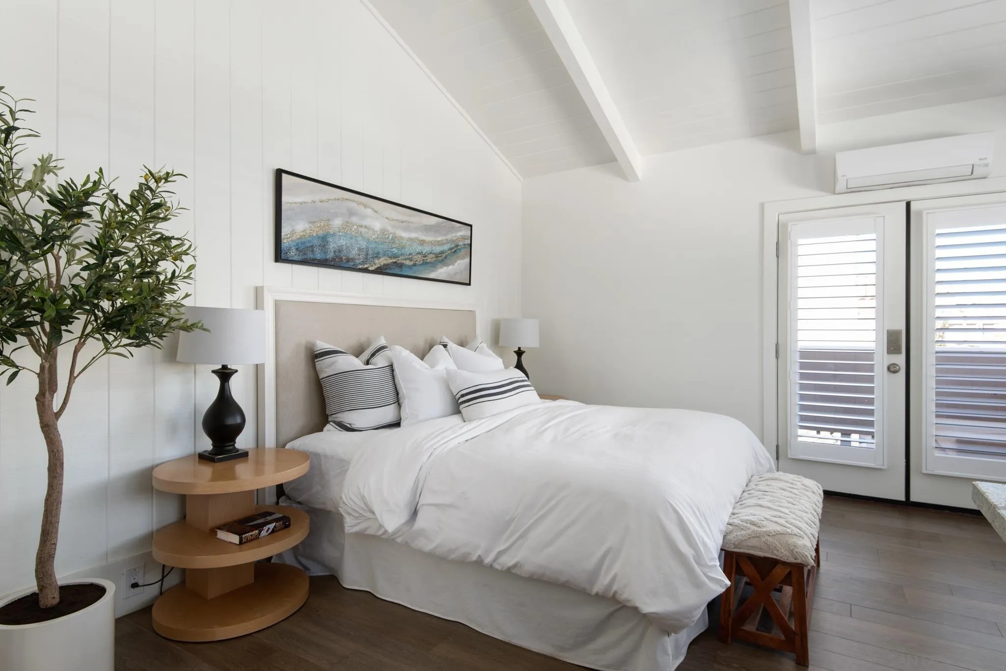 1933 Coast Boulevard Del Mar, CA 92014 - Photo 9 of 47 a bedroom with a bed and a potted plant