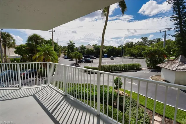 a view of a balcony with wooden fence