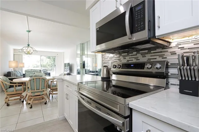 a kitchen with a stove and a microwave