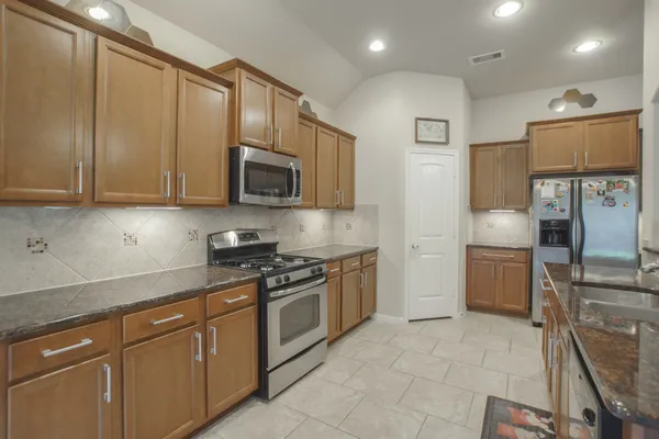 a dining room with furniture and a chandelier