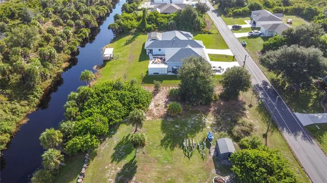an aerial view of a house with a yard