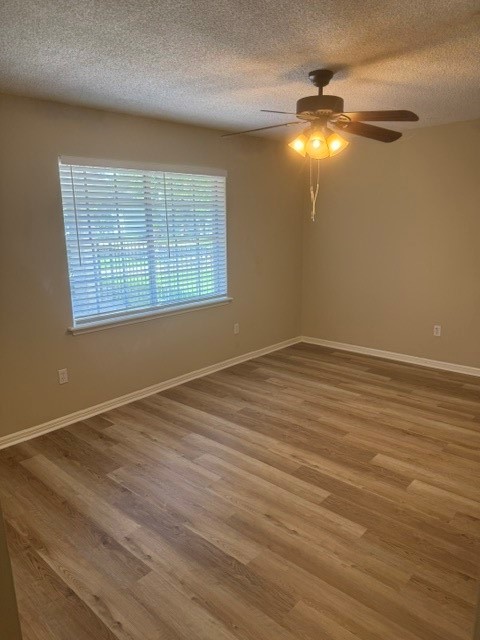 6026 Coral Ridge Road Houston, TX 77069 - Photo 27 of 34 2nd bedroom with new floors and ceiling fan