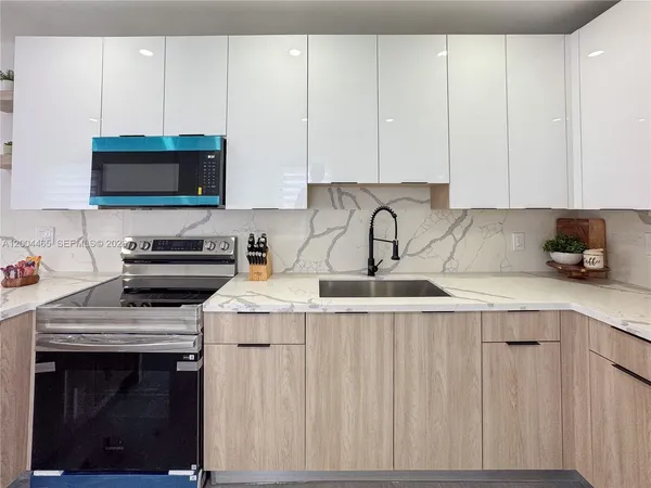 a kitchen with a stove and cabinets